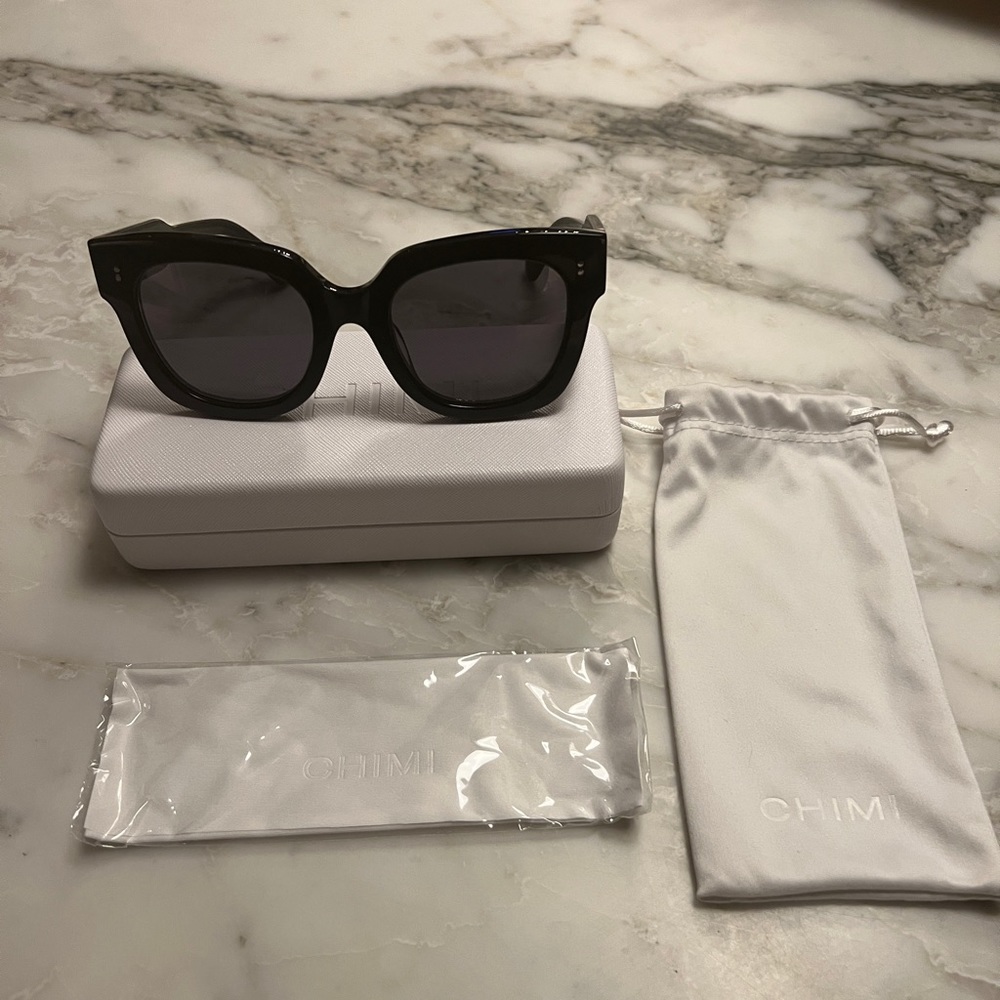Brand new unused Chimi 08 Black sunglasses with pouch, cloth, hard shell case.